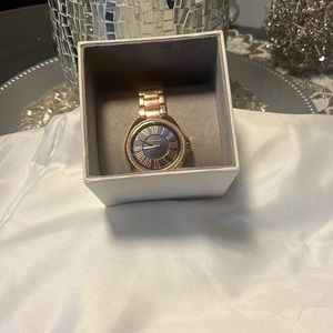 Michael Kors womens rose gold watch.